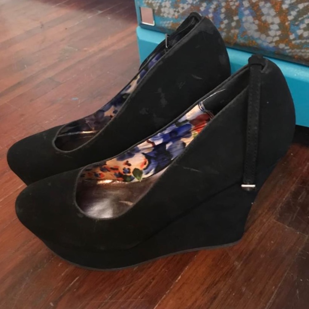 Black wedge type heels. Size 8 1/2. Like new only worn once!